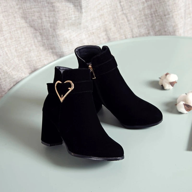 Drag Queen’s Chic Strut: Heart-Embellished Ankle Boots in Beige, Black, & Red