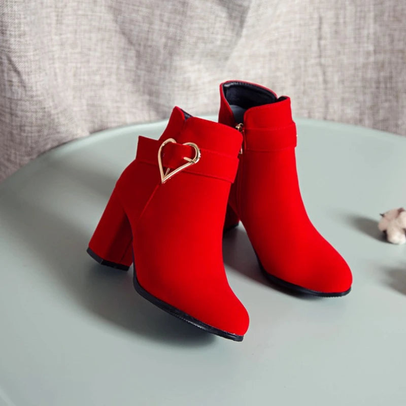 Drag Queen’s Chic Strut: Heart-Embellished Ankle Boots in Beige, Black, & Red