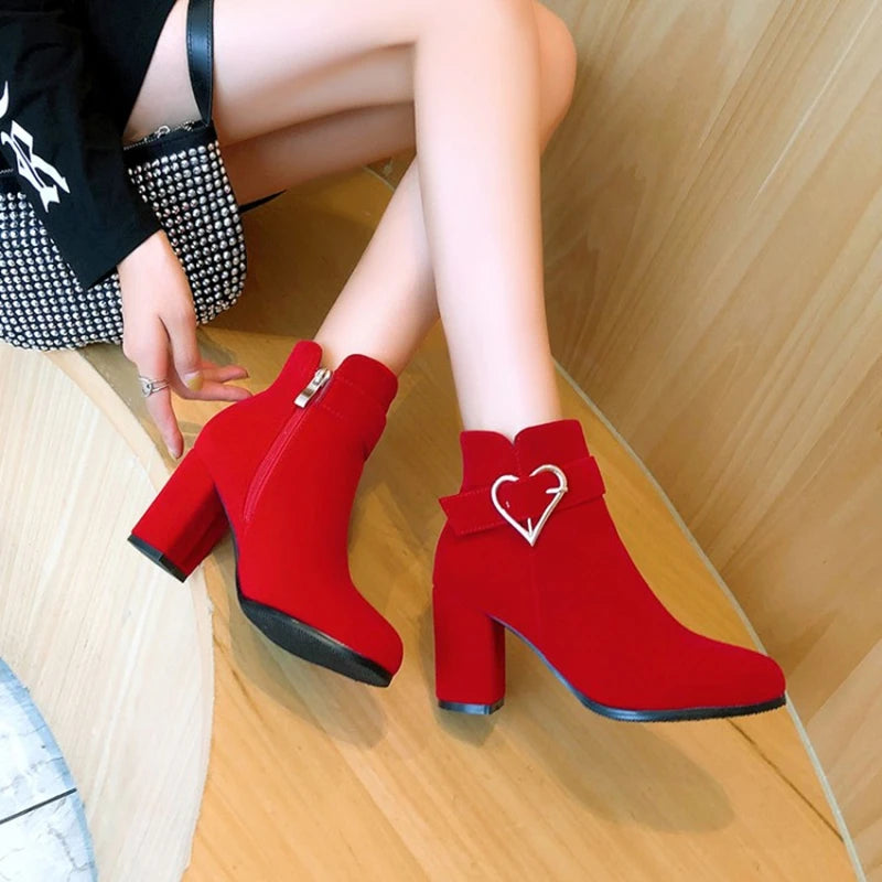 Drag Queen’s Chic Strut: Heart-Embellished Ankle Boots in Beige, Black, & Red